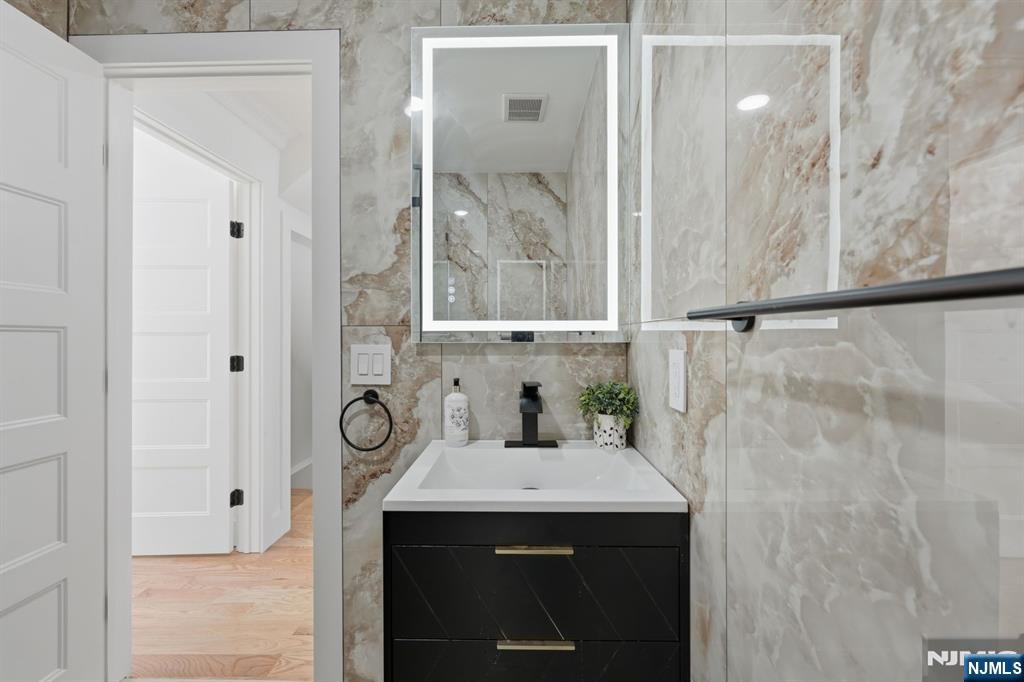 275 Longview Road Union, NJ 07083 - Photo 19 of 43 a bathroom with a sink and a mirror