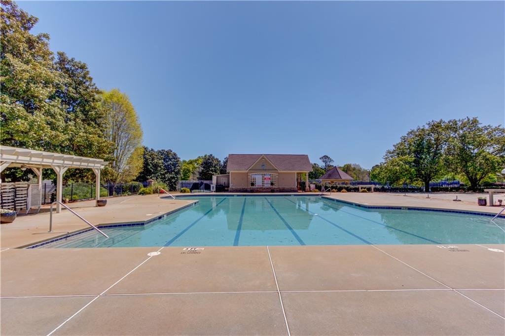 2310 Olde Hickory Place Monroe, GA 30656 - Photo 40 of 46 a view of a tennis ground with large trees