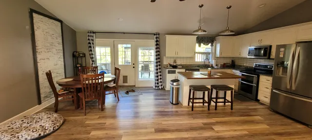 a view of a dining room with furniture window and wooden floor