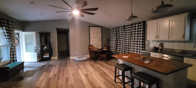a kitchen with a sink a counter space and stainless steel appliances