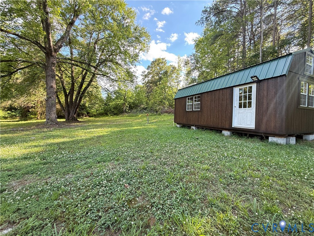 110 Locust Grove Cartersville, VA 23027 - Photo 26 of 26 a view of a backyard with large trees