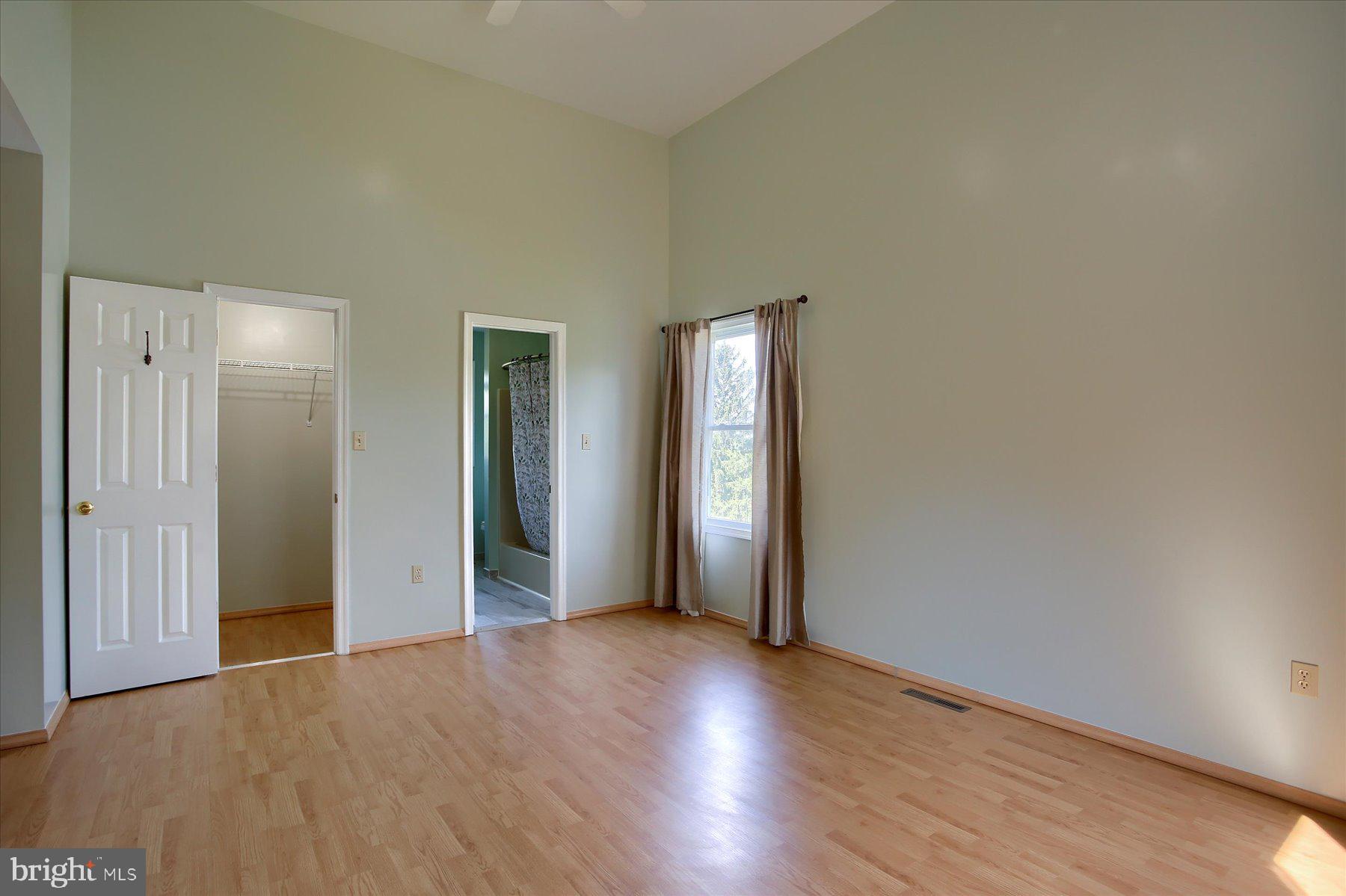 908 Sunnyside Road Hummelstown, PA 17036 - Photo 17 of 41 an empty room with wooden floor and closet
