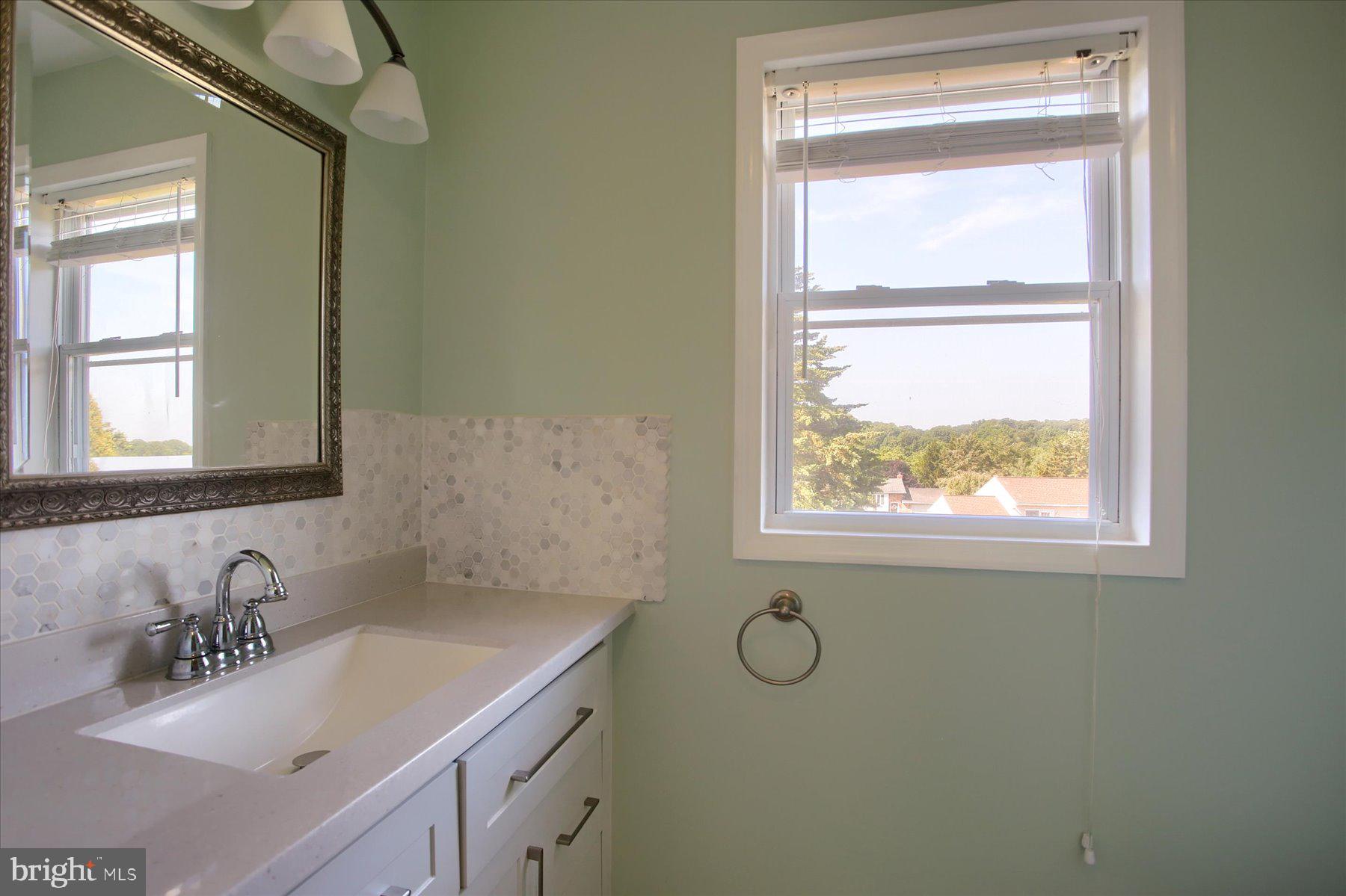 908 Sunnyside Road Hummelstown, PA 17036 - Photo 18 of 41 a bathroom with a sink a vanity and a window