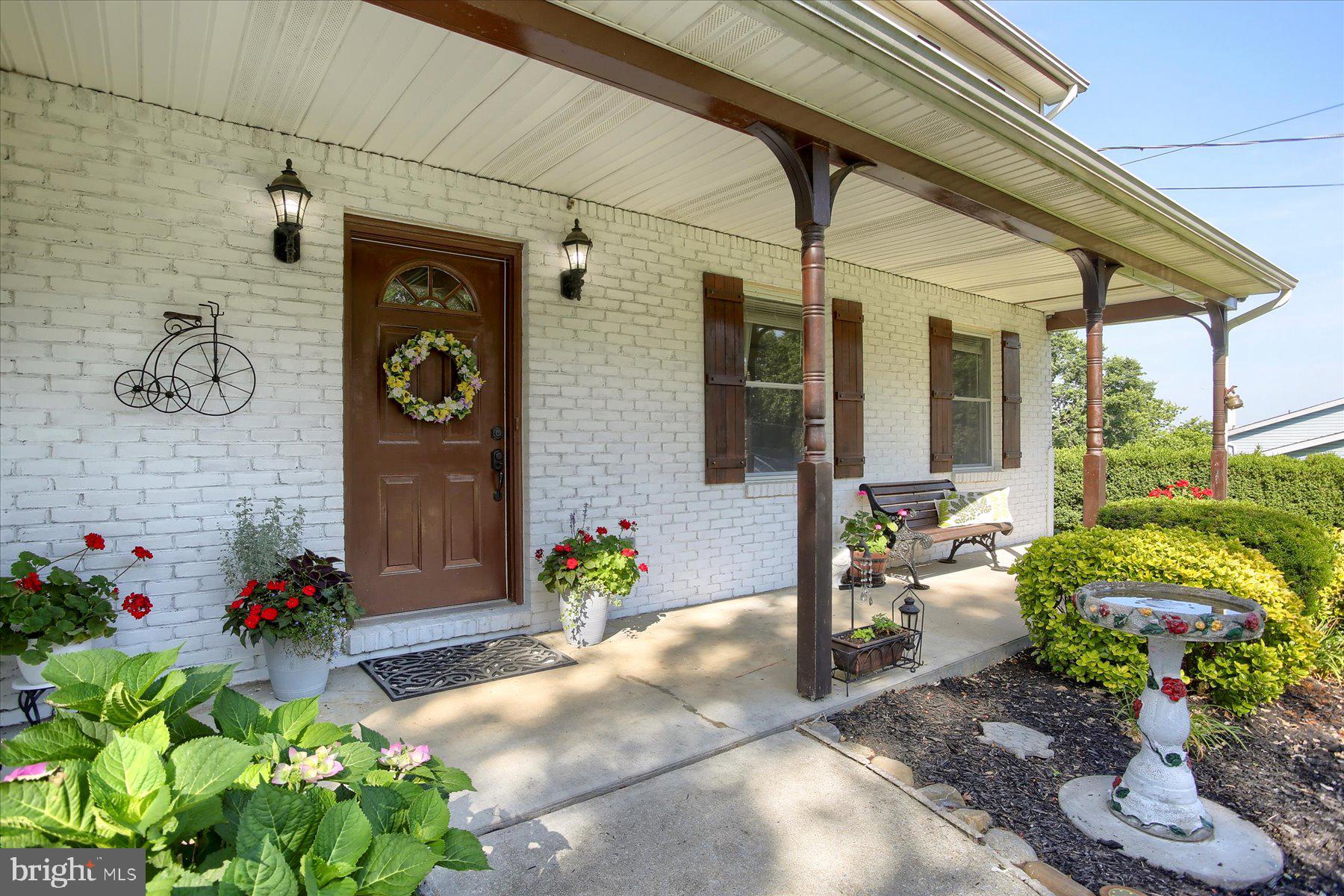 908 Sunnyside Road Hummelstown, PA 17036 - Photo 3 of 41 a front view of a house with a porch