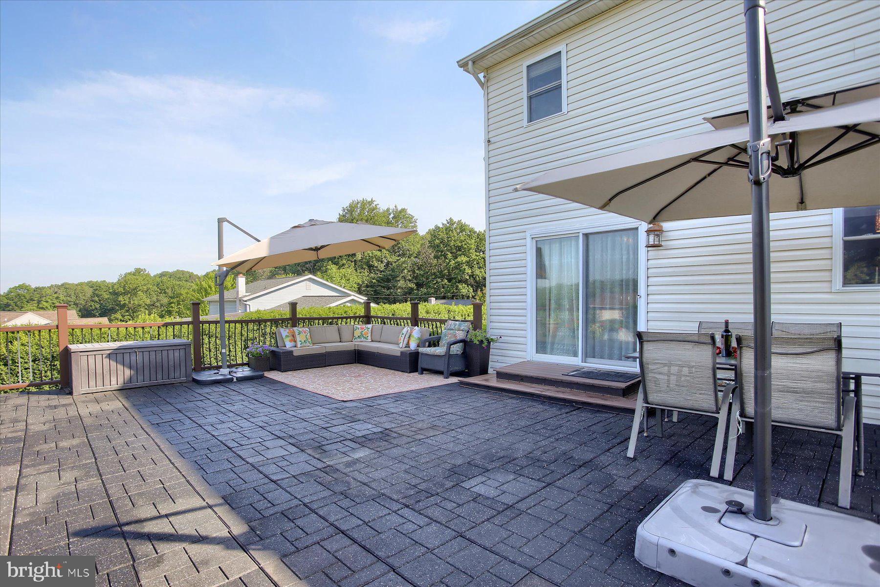 908 Sunnyside Road Hummelstown, PA 17036 - Photo 36 of 41 a view of a backyard with furniture and a garage