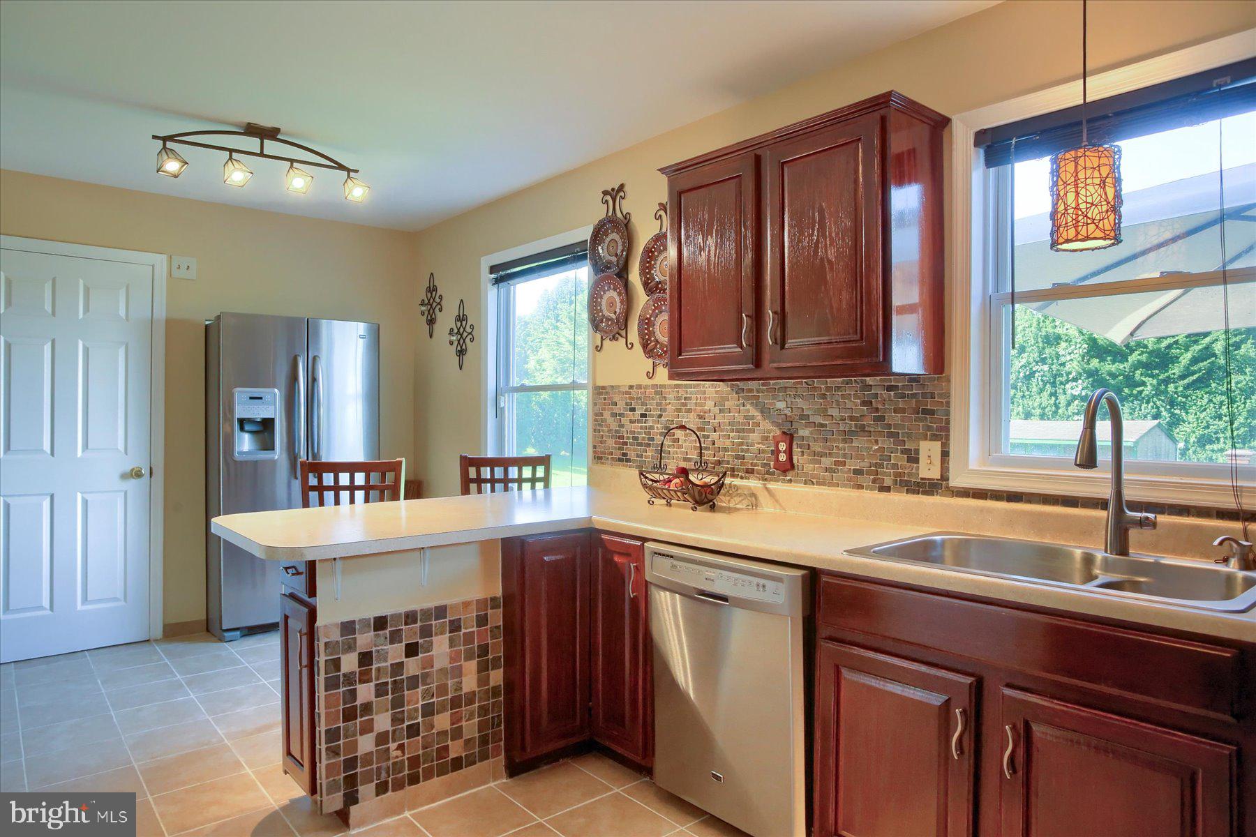 908 Sunnyside Road Hummelstown, PA 17036 - Photo 8 of 41 a kitchen with a sink stove and cabinets