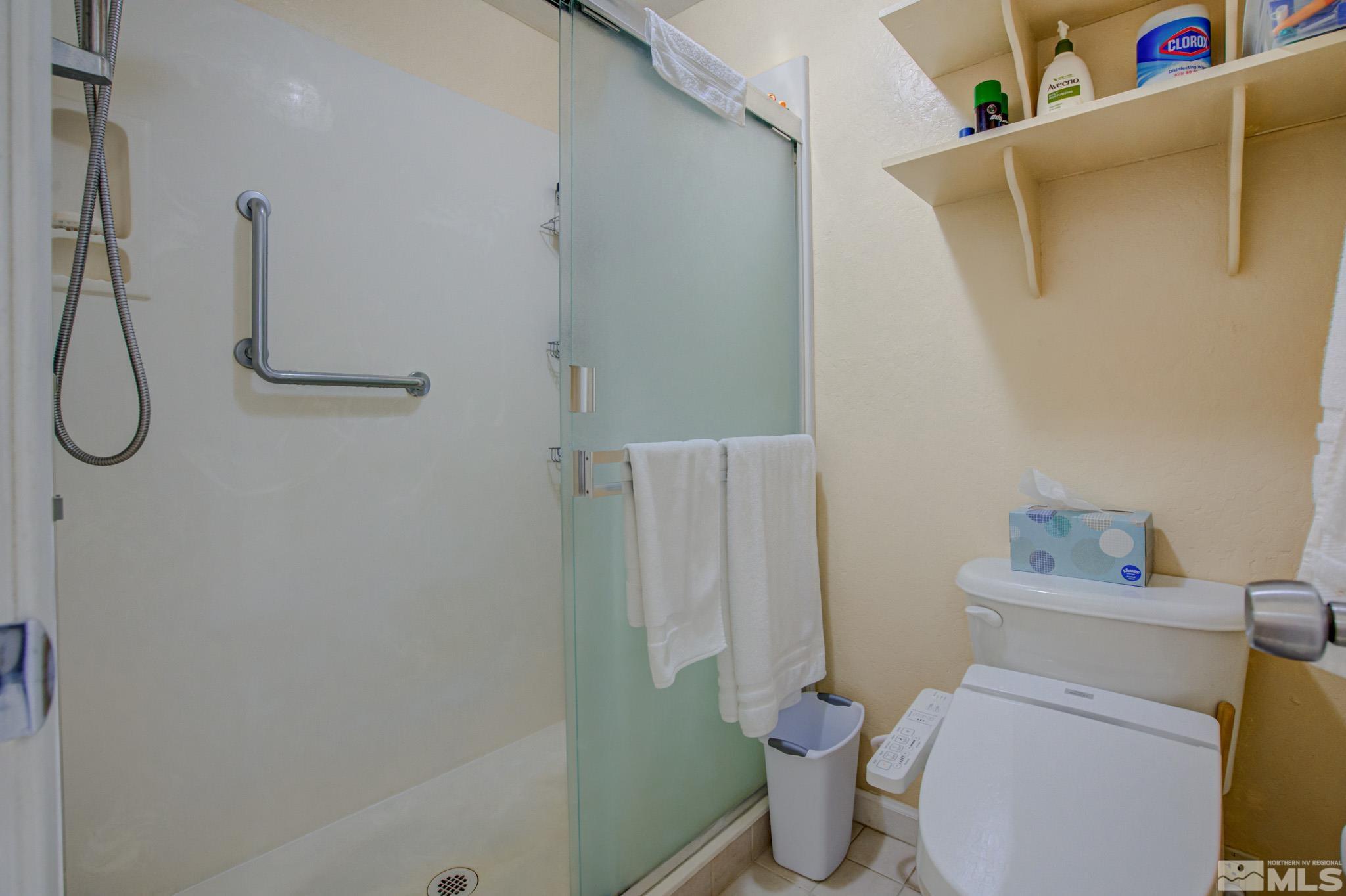 1208 Laredo Court Reno, NV 89503 - Photo 21 of 30 a bathroom with a toilet and a shower