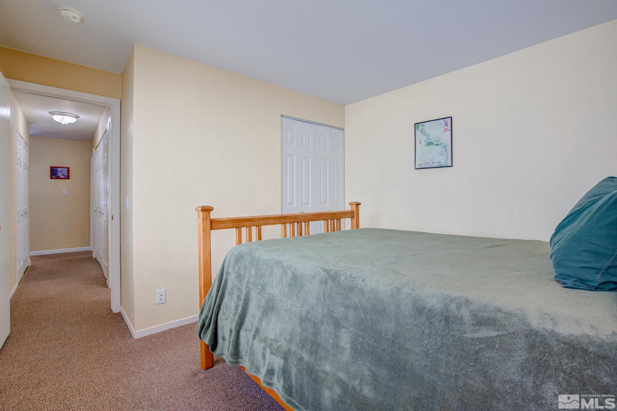 1208 Laredo Court Reno, NV 89503 - Photo 24 of 30 a view of a hallway with a bedroom