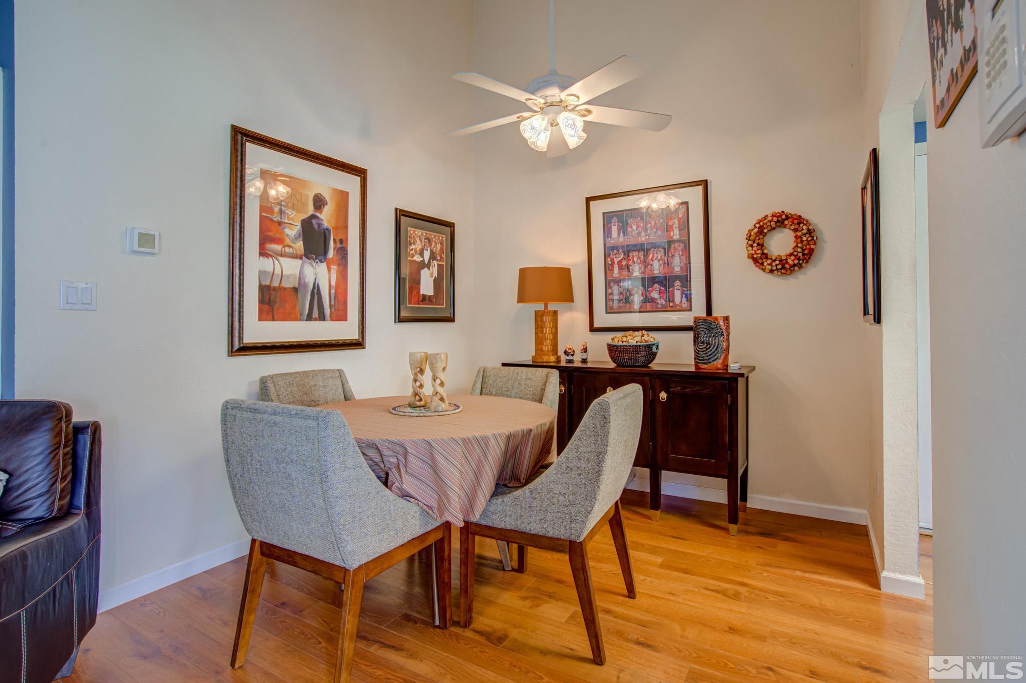 1208 Laredo Court Reno, NV 89503 - Photo 8 of 30 a view of a dining room with furniture and chandelier