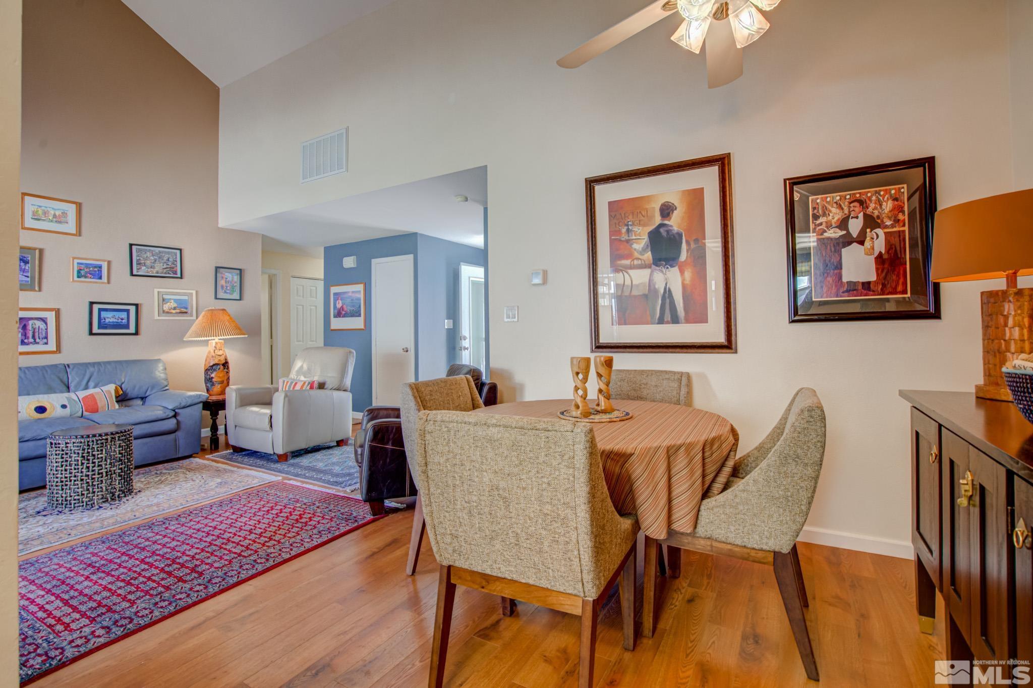 1208 Laredo Court Reno, NV 89503 - Photo 10 of 30 a view of a dining room with furniture wooden floor and a chandelier