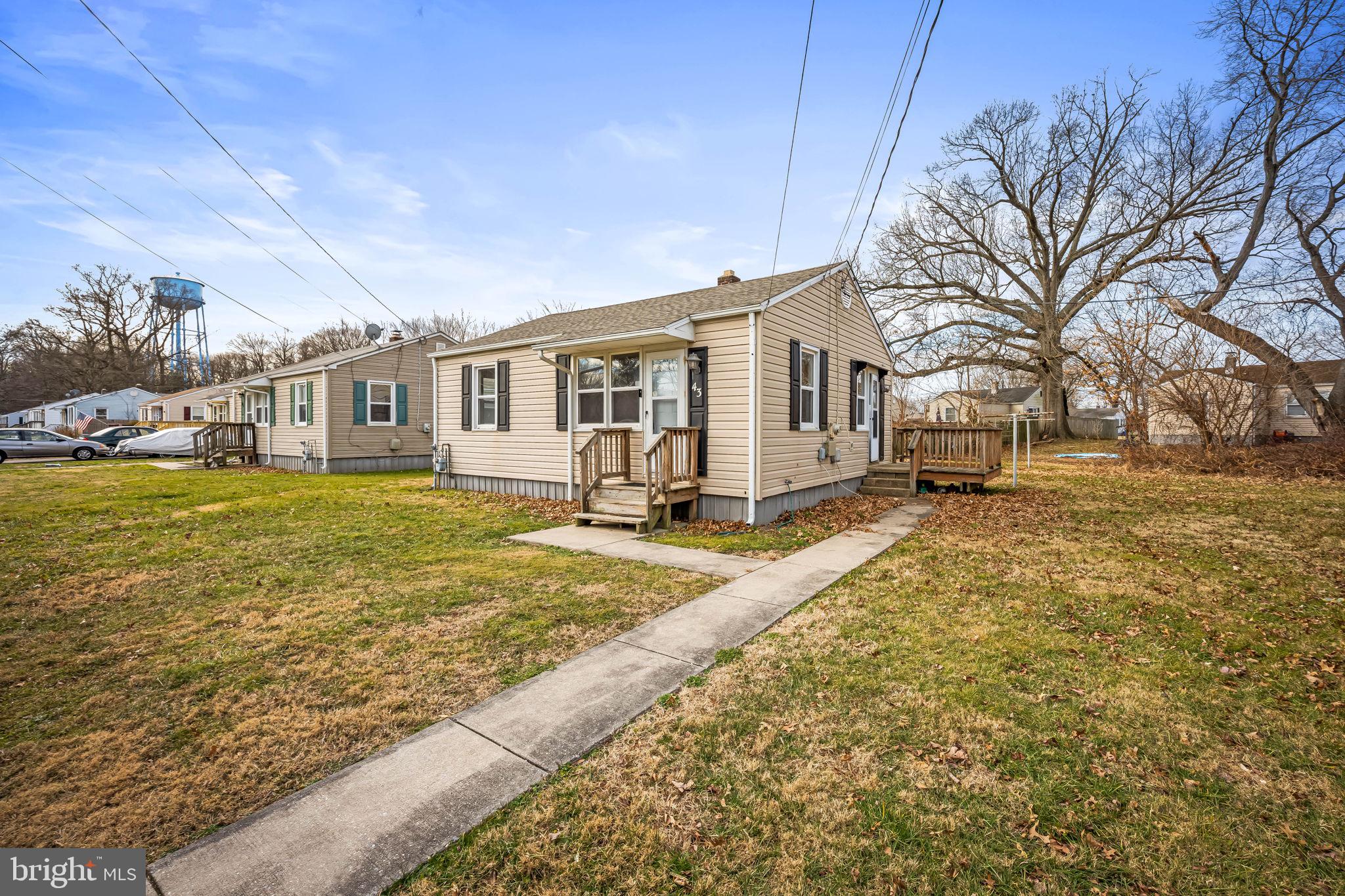 a view of a house with a yard