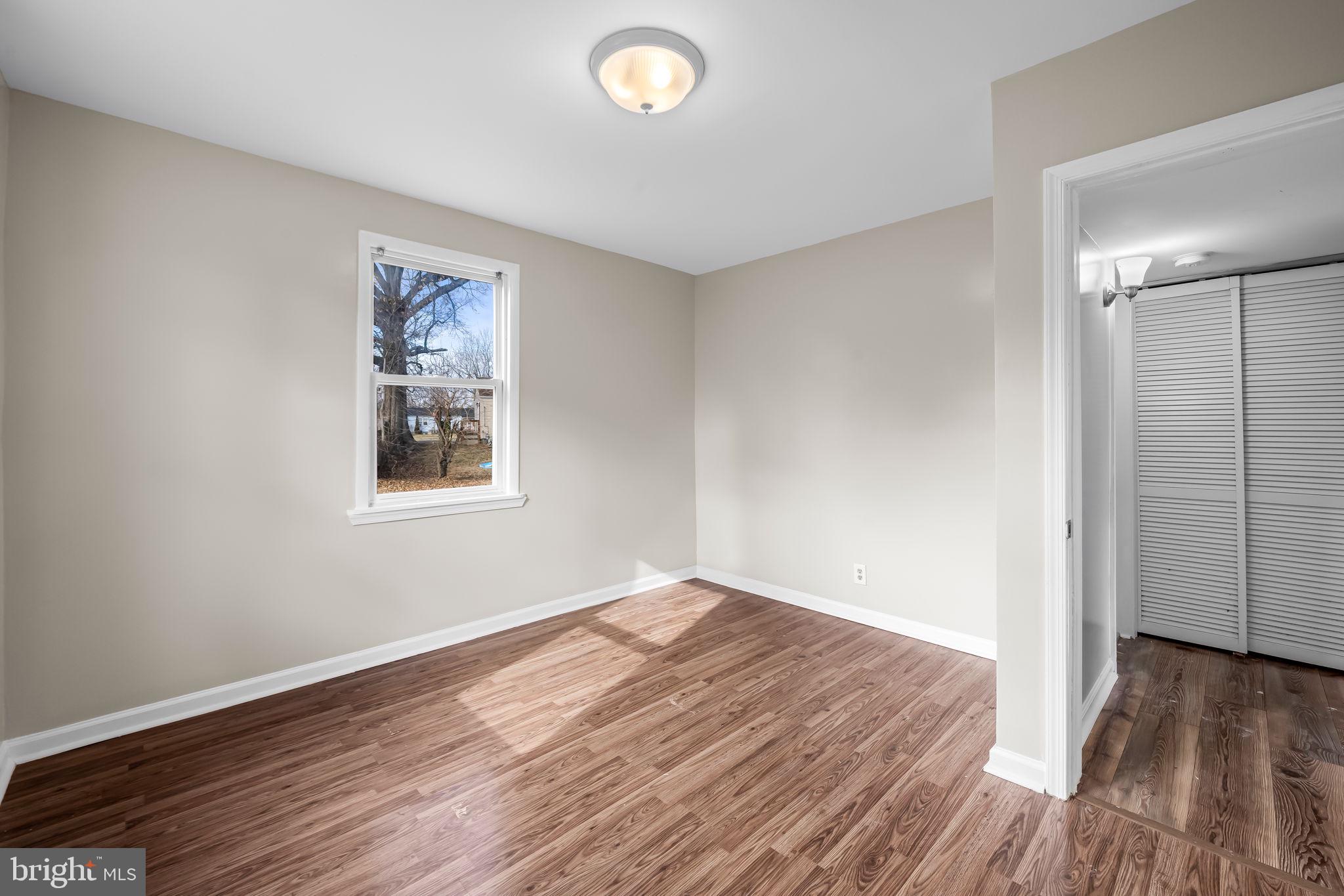 43 Liberty Street Aberdeen, MD 21001 - Photo 12 of 12 an empty room with wooden floor and windows