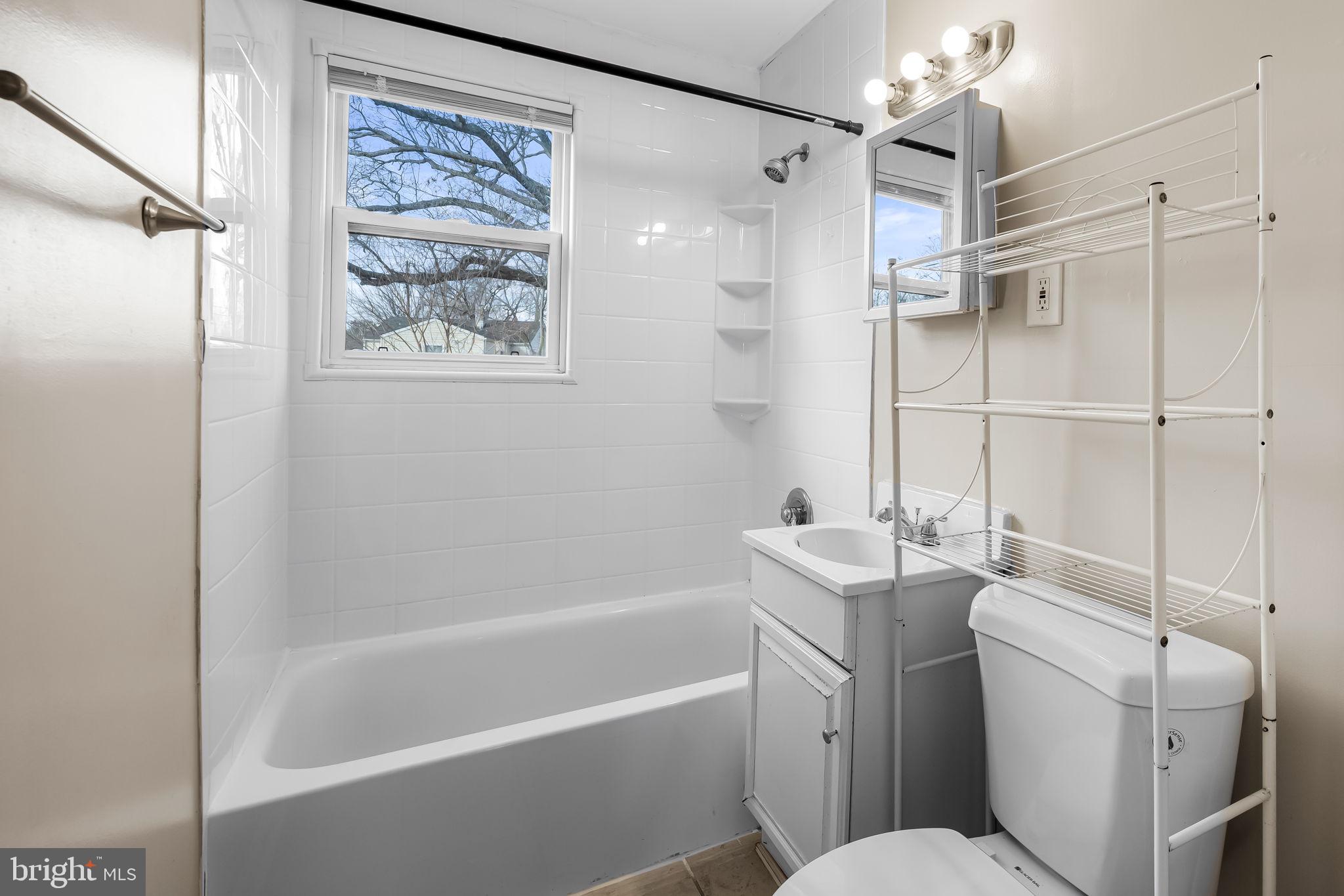 43 Liberty Street Aberdeen, MD 21001 - Photo 9 of 12 a bathroom with a toilet sink and shower