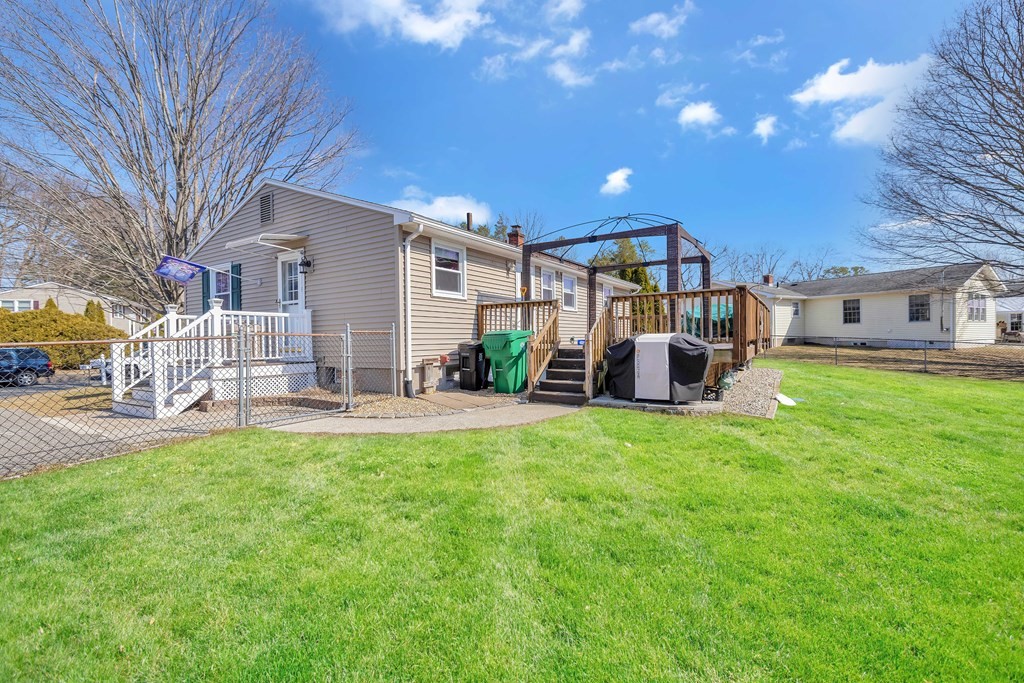 20 Murphy Lane Chicopee, MA 01020 - Photo 17 of 22 a view of a house with backyard and a tree