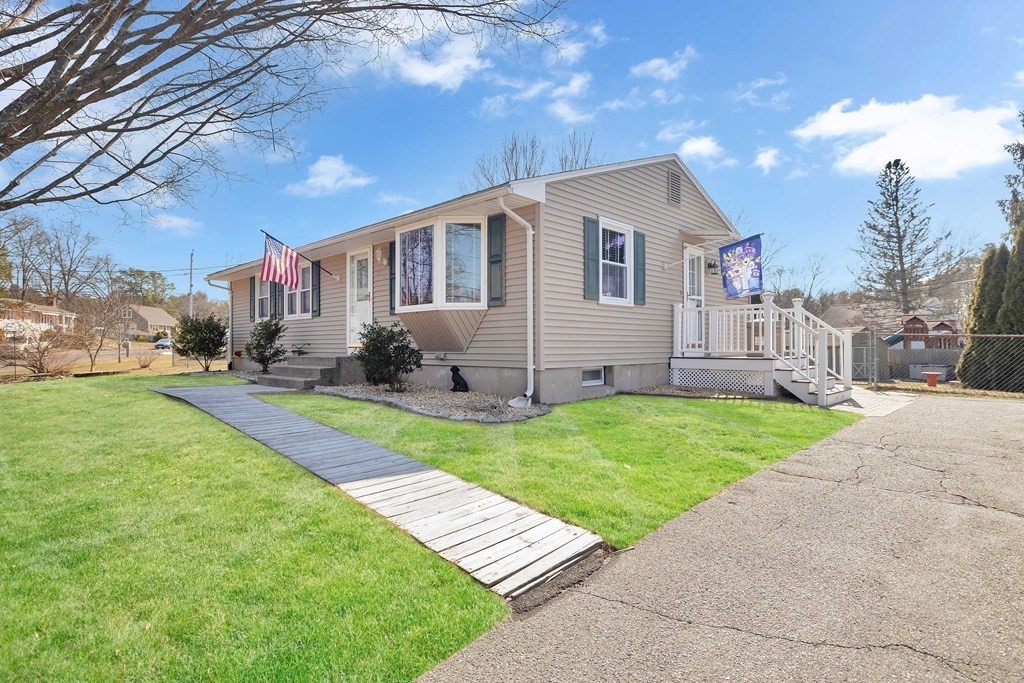 20 Murphy Lane Chicopee, MA 01020 - Photo 21 of 22 a front view of a house with a yard and trees