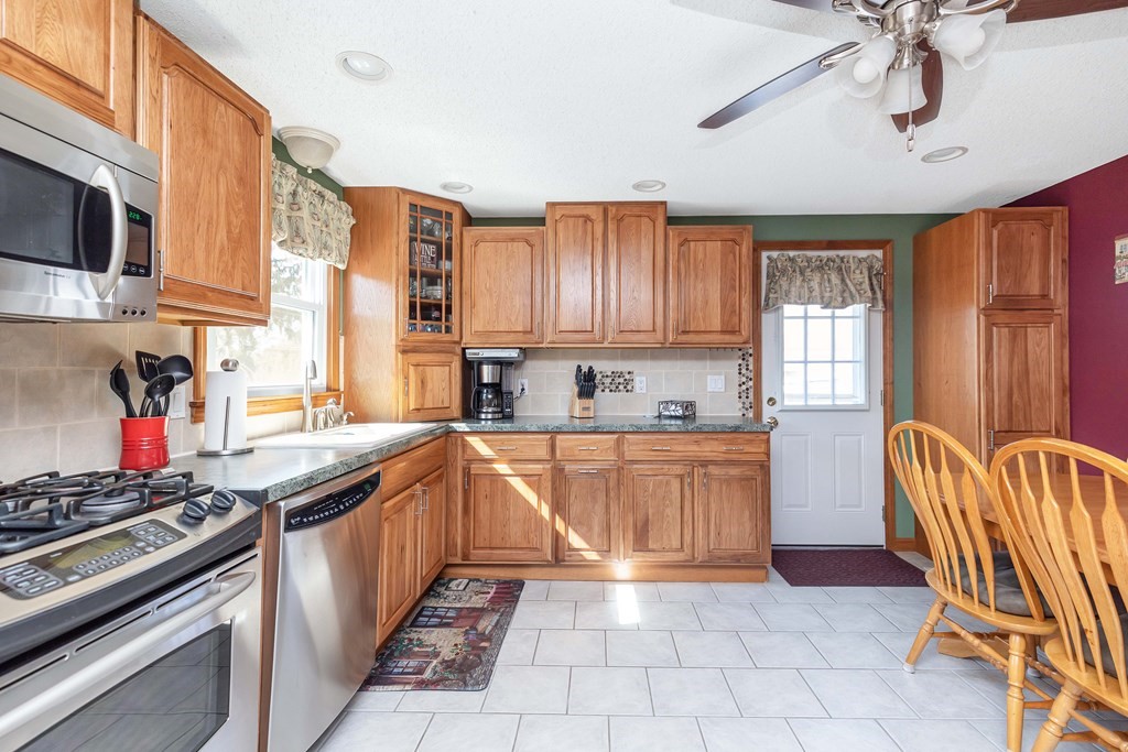 20 Murphy Lane Chicopee, MA 01020 - Photo 5 of 22 a kitchen with stainless steel appliances granite countertop a stove and a sink