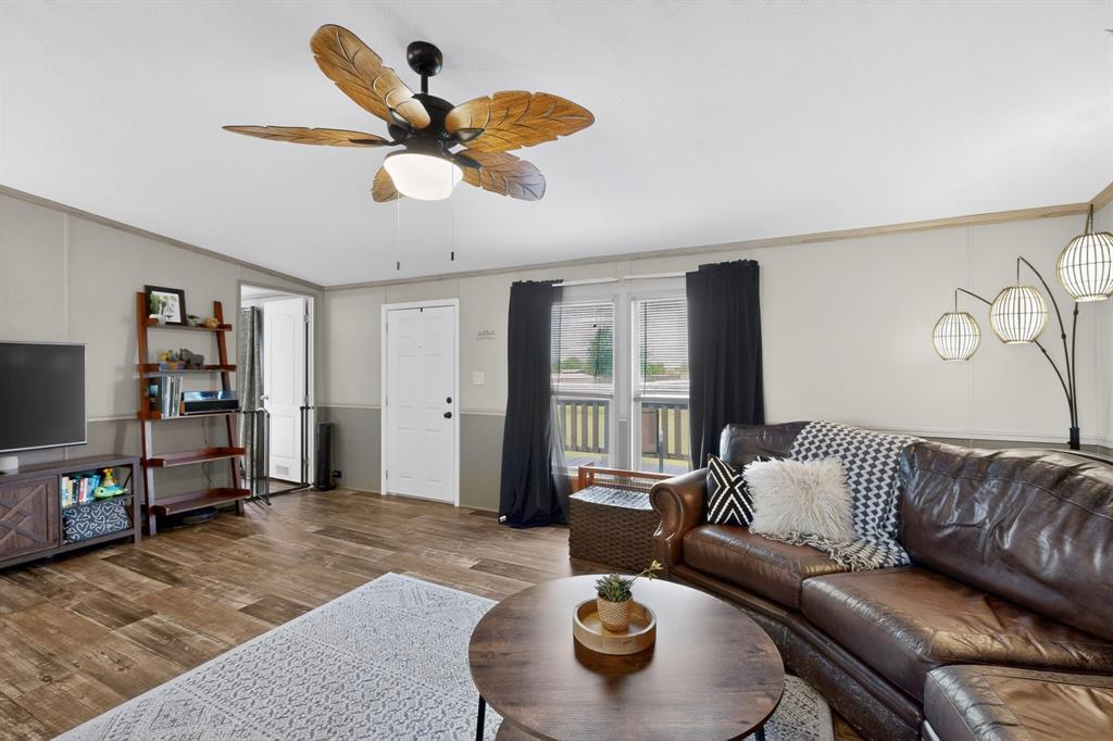 a living room with furniture and a rug
