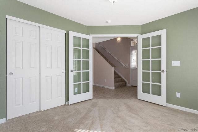 an empty room with a empty space and windows