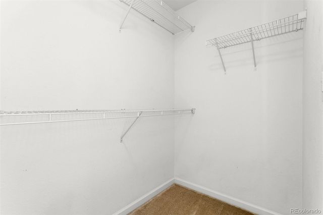 a view of a balcony with wooden floor and fence