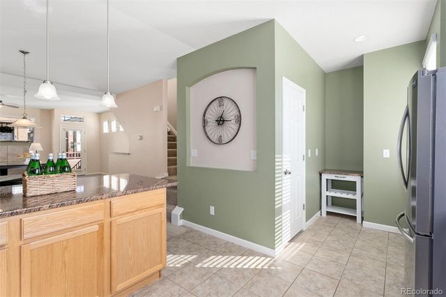 a view of kitchen with cabinets and outdoor space