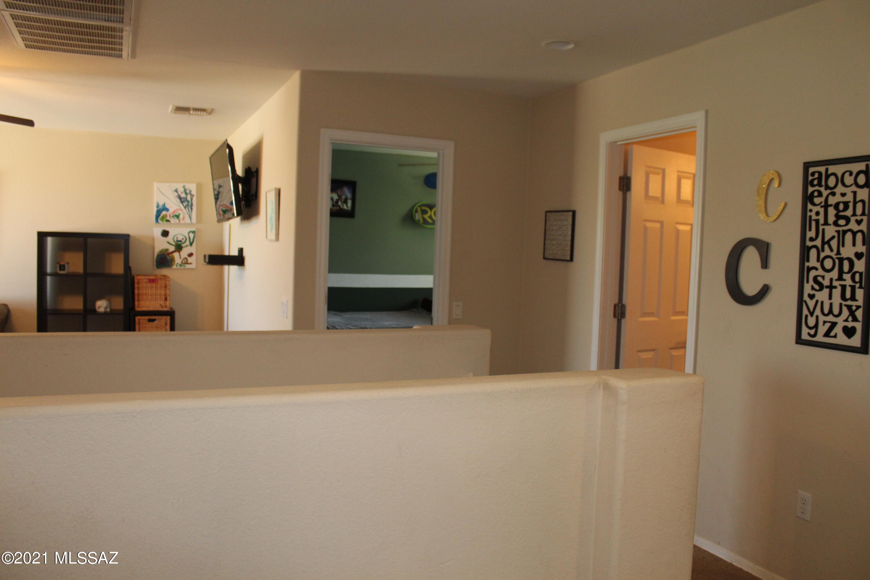 20951 East Reunion Road Red Rock, AZ 85145 - Photo 30 of 35 a view of a hallway with entryway to rooms