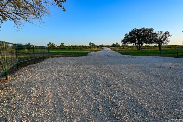 a view of a field with an ocean