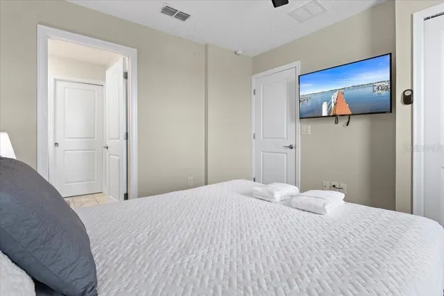 a bedroom with a bed and bathroom