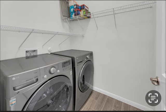 a utility room with dryer and washer