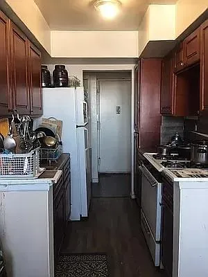 a kitchen with a stove and a refrigerator