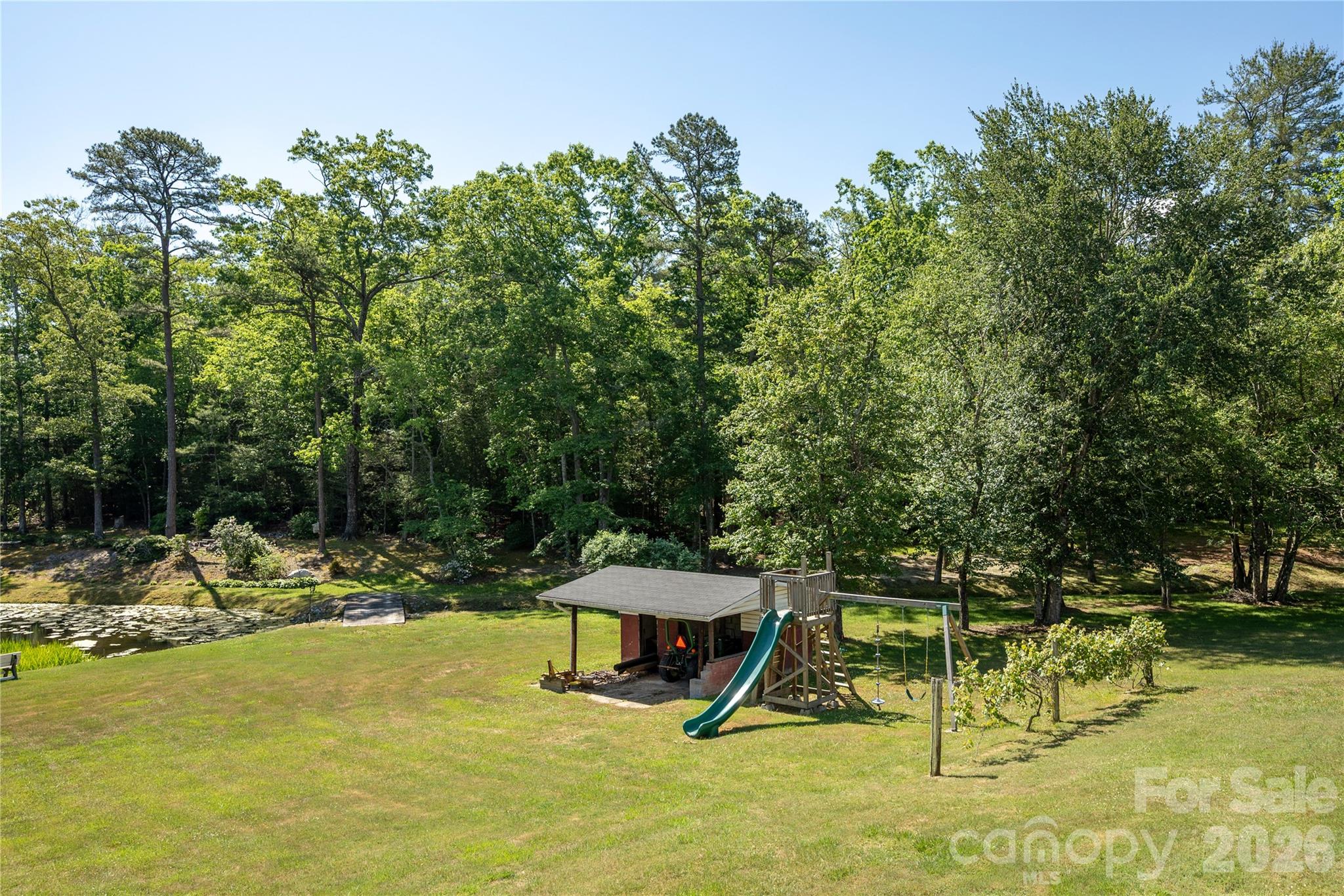 231 Allen Road East Flat Rock, NC 28726 - Photo 33 of 42 a view of swimming pool with a table and chairs