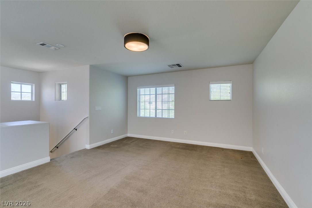 8909 Houston Ridge Avenue Las Vegas, NV 89178 - Photo 27 of 45 A versatile open space with soft carpeting awaits your personal touch.