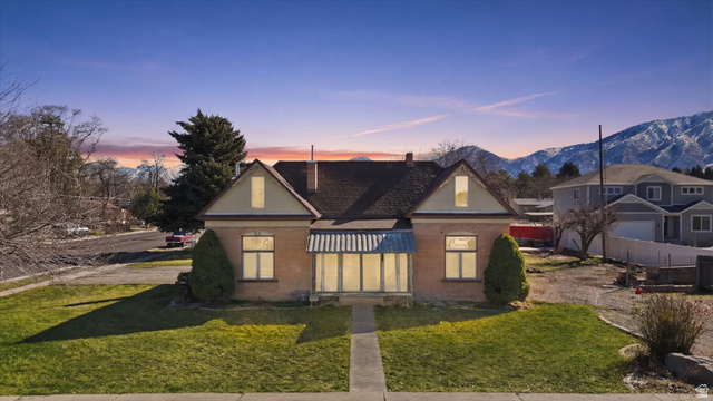 311 South 400 West Payson, UT 84651 - Photo 1 of 1 View of front of house with a front lawn, brick siding, and a chimney