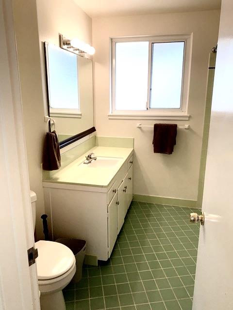 90 Quarterdeck Way Pacific Grove, CA 93950 - Photo 12 of 14 a bathroom with a toilet sink and mirror