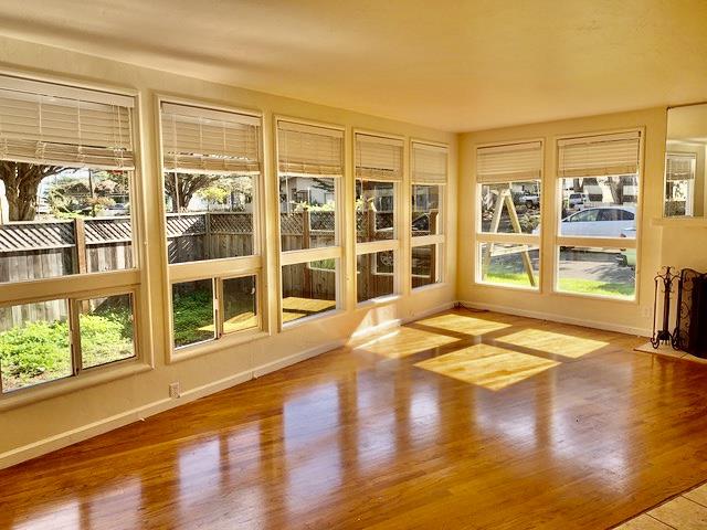 90 Quarterdeck Way Pacific Grove, CA 93950 - Photo 3 of 14 a view of an empty room with wooden floor and a window