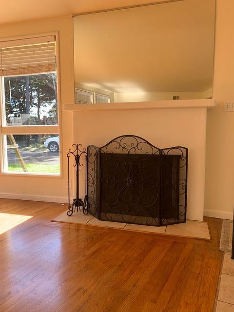 90 Quarterdeck Way Pacific Grove, CA 93950 - Photo 4 of 14 an empty room with wooden floor and windows