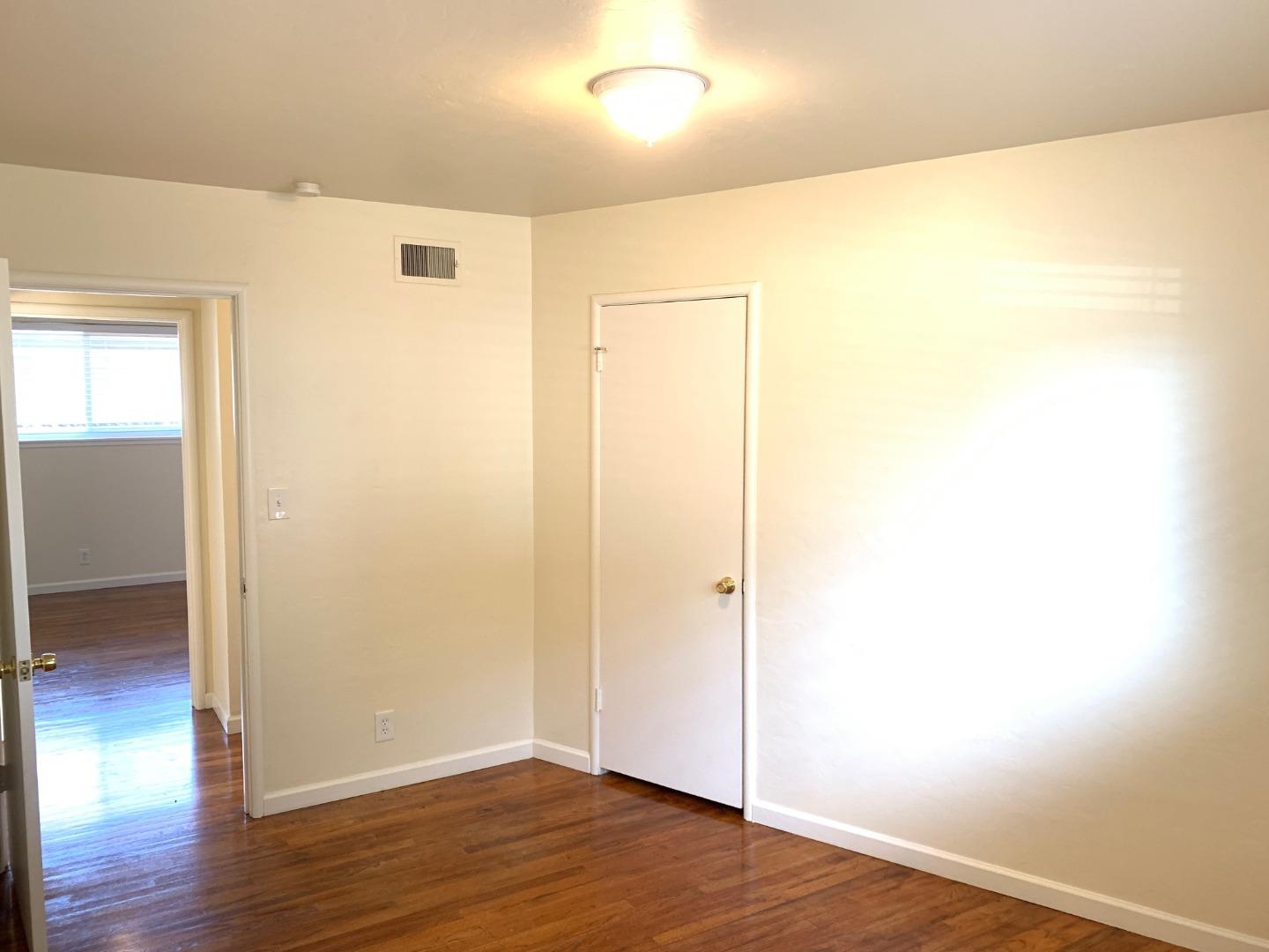 90 Quarterdeck Way Pacific Grove, CA 93950 - Photo 7 of 14 a view of an empty room with wooden floor