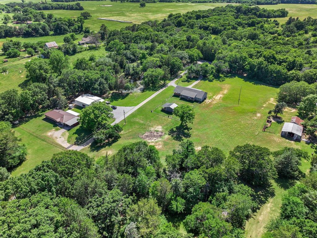 2658 Oak Ridge Road Denison, TX 75021 - Photo 35 of 37 an aerial view of residential houses with outdoor space and trees all around