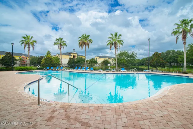 a view of a swimming pool with a patio