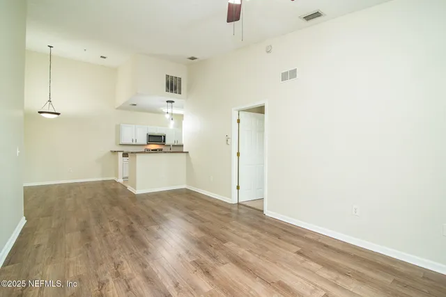 a view of kitchen with wooden floor