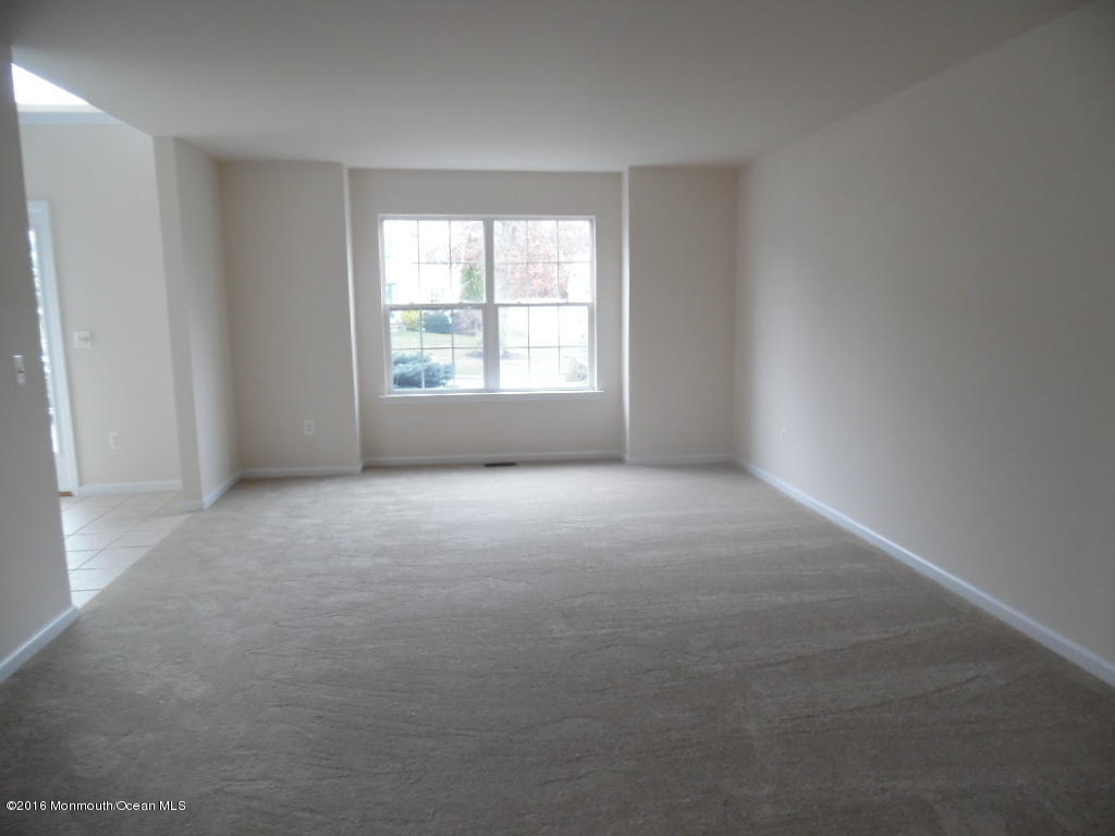 125 Swordfish Road Manahawkin, NJ 08050 - Photo 10 of 15 a view of an empty room with a window