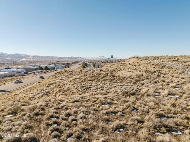 an aerial view of house with yard