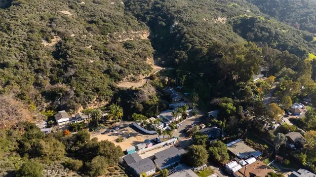 a view of a pathway of a house with a yard