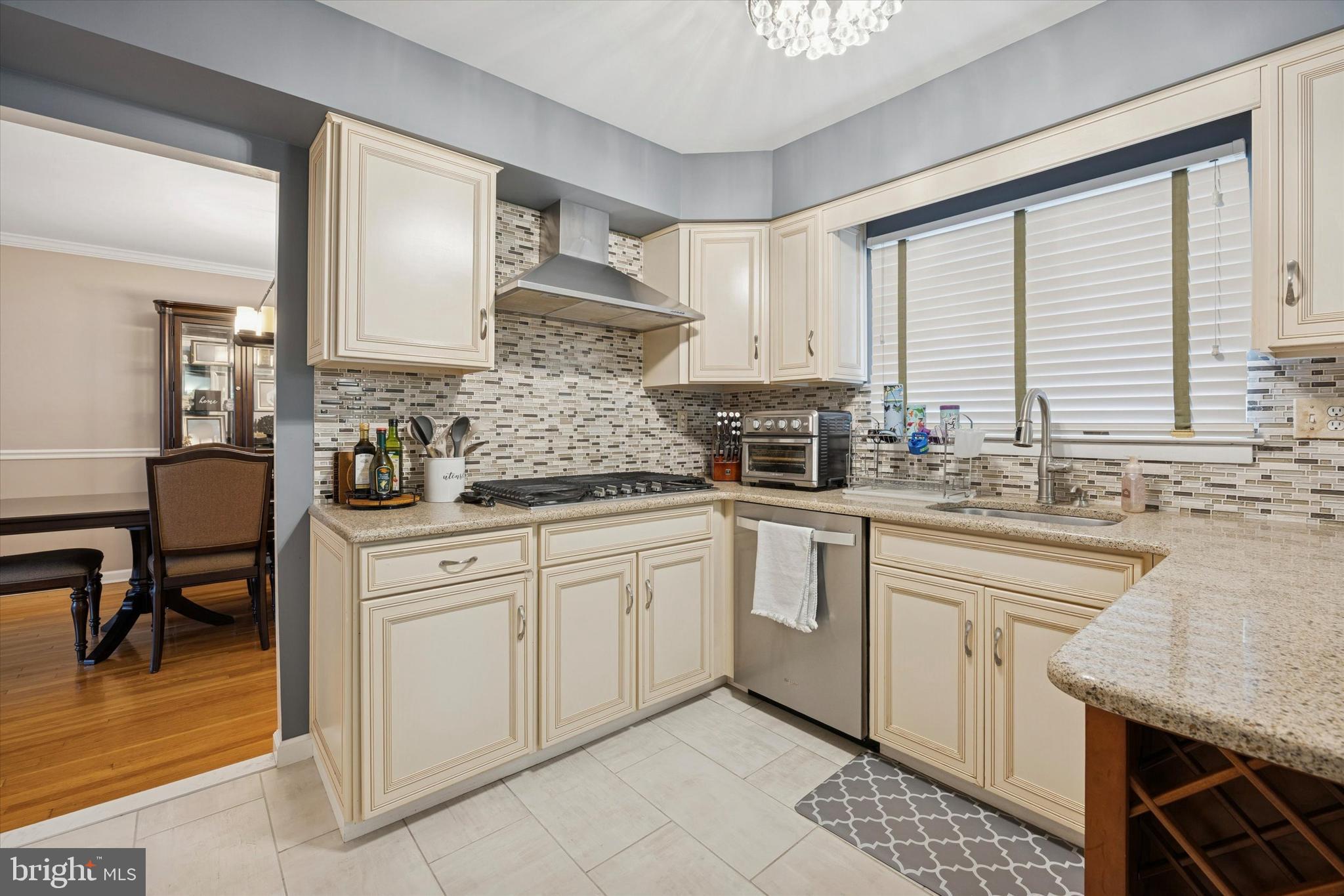 740 Grant Road Mount Laurel, NJ 08054 - Photo 11 of 35 a kitchen with a sink stove and cabinets