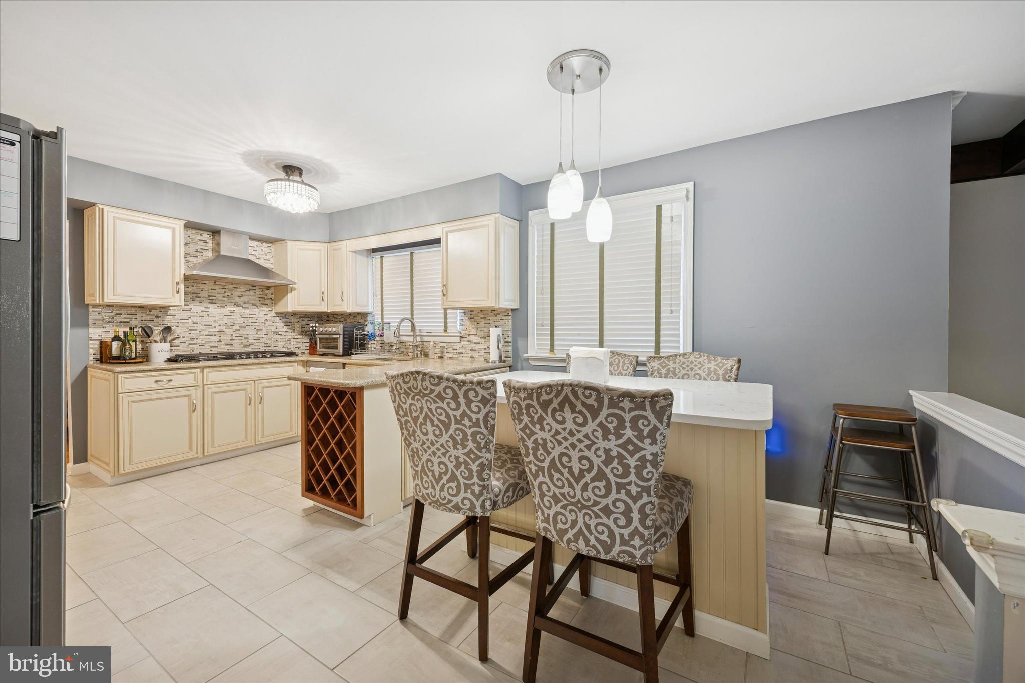 740 Grant Road Mount Laurel, NJ 08054 - Photo 14 of 35 a kitchen with a table chairs microwave and cabinets