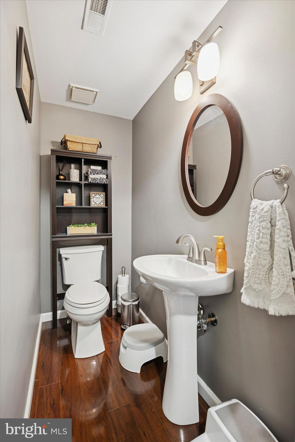 740 Grant Road Mount Laurel, NJ 08054 - Photo 21 of 35 a bathroom with a toilet a sink and a mirror