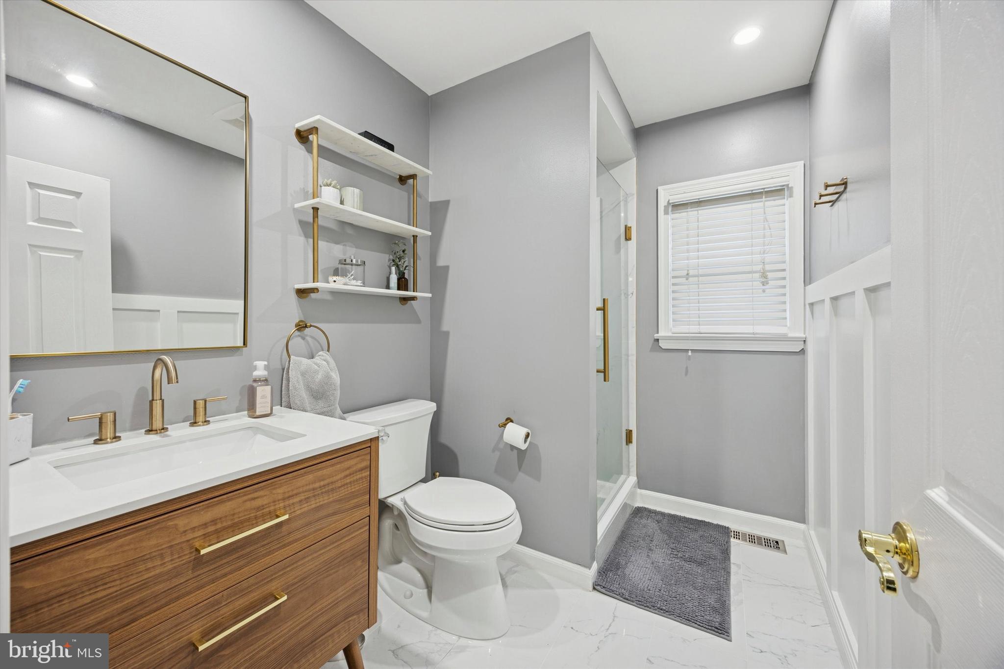 740 Grant Road Mount Laurel, NJ 08054 - Photo 28 of 35 a bathroom with a toilet sink and mirror