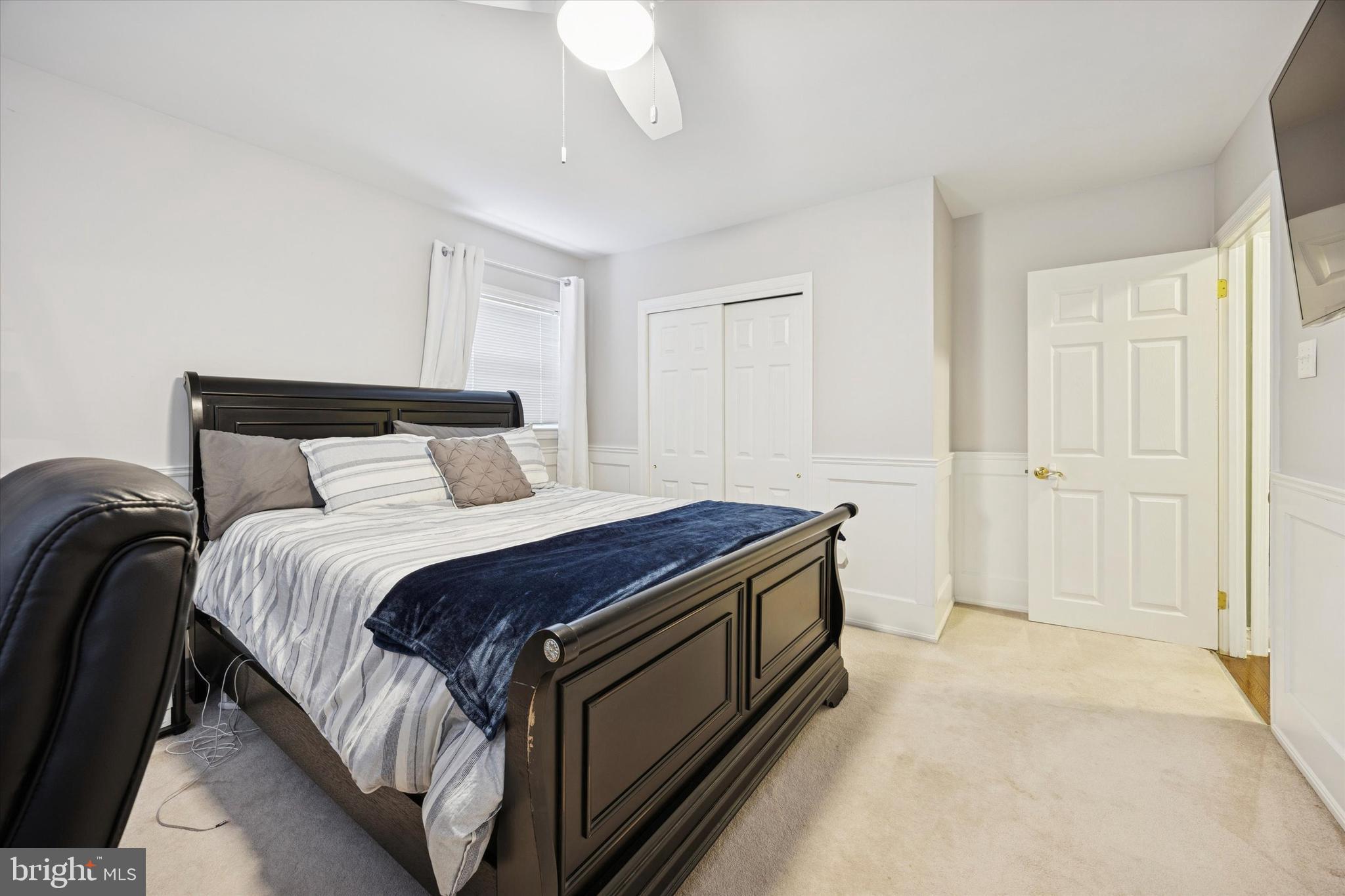 740 Grant Road Mount Laurel, NJ 08054 - Photo 31 of 35 a bedroom with a bed and a chandelier