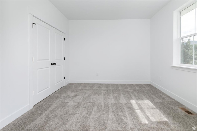 314 North 200 West Logan, UT 84321 - Photo 23 of 37 Unfurnished bedroom with light colored carpet and baseboards