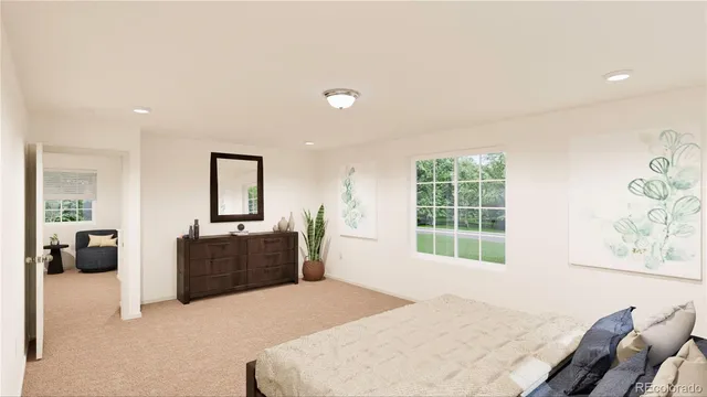 a bedroom with a bed and a couch