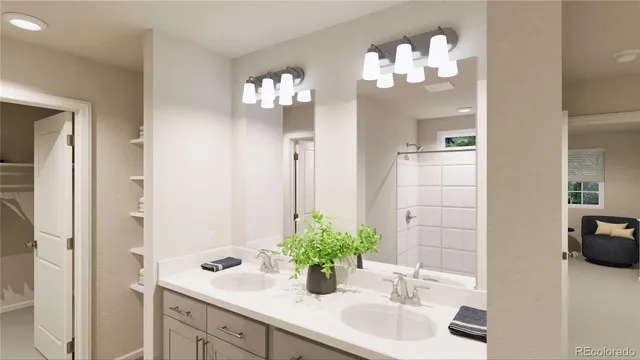 a bathroom with a sink a potted plant and a mirror